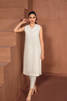 Khaadi Est22110a Off-white Eid Collection 2022 Original brand suit fabric and photography lite diffrance in actual print. Festive White V-neck Sets, Elegant White V-neck Set, Elegant Unstitched White Dress, Unstitched Cream Dress For Summer, Unstitched Off White Summer Sets, Fitted Cream Lawn Suit For Summer, White Sleeveless Dress With Chikankari Embroidery, Elegant White Summer Sets, Off White Chikankari Embroidery Sets For Summer