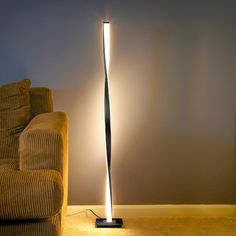 The elegant and unique style of the modern Helix LED Floor Lamp is sure to impress any that beholds its beauty. The gently twisting fixture stays true to that modern elegance, making it a beautiful addition to your bedroom, office, or study! Brightech 48-in Classic Black Stick Floor Lamp | HLX-BLCK Pole Lamp, Pole Lamps, Stylish Floor Lamp, Industrial Floor Lamps, Tall Lamps, Torchiere Floor Lamp, Led Floor, Modern Floor, Floor Standing Lamps