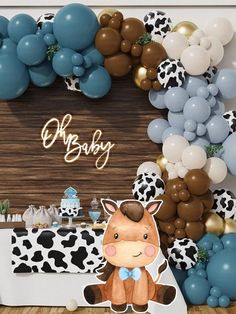 an animal themed baby shower with balloons and decorations