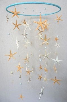 a mobile with stars hanging from it's side