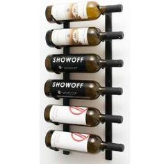 a wine rack with six bottles of wine on it and the words showoff above them