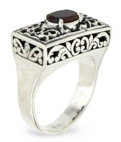 Superbly crafted of sterling silver this design is the creation of Buana in Bali. Crowning ornate filigree settings a faceted garnet the January??s birthstone takes center stage in a ring of feminine elegance. .925 Sterling silver Ornate Ruby Ring With Filigree, Classic Garnet Rings With Intricate Design, Ornate Silver Ruby Ring With Filigree Details, Ornate Filigree Garnet Jewelry, Ornate Filigree Ring With Stone Setting, Garnet Rings With Intricate Design For Gift, Ornate Sterling Silver Ruby Ring, Ornate Garnet Filigree Jewelry, Ornate Ruby Filigree Ring