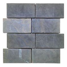 a close up view of some gray tiles on a white background with no one in it