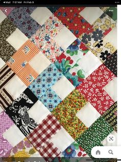 a close up of a colorful patchwork quilt