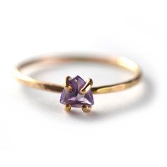 Trillion Cut Amethyst Solitaire RingA trillion cut sparkling purple amethyst prong set in 14k gold-fill with skinny hammered band. So perfectly dainty and great for stacking. Amethyst is the February Birthstone.This style ring available in a variety of natural gemstones including:Garnet (January)Amethyst (February)Aquamarine (March)White Topaz (April)Emerald* (May) Alexandrite* (June)Ruby* (July)Peridot (August)Blue Sapphire* (September)Pink Sapphire (September)Opal (October)Pink Tourmaline (Oct Modern Silver Ring, October Pink, Moonstone Engagement Ring Set, February Birthstone Ring, Gemstone Stacking Ring, Ring Selfie, Vintage Engagement Rings Unique, Hammered Band, Moonstone Engagement Ring