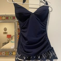 New Navy Blue Gottex Onepiece Swimsuit With Halter Top And Fashioned Skirt. Padded And Fitted Cups. Size Medium 12 (European 42). Tummy Tuck Control, Slimming. Really Cute Design. Original Price $138. Navy Sleeveless Fitted Swimwear, Fitted Navy Tankini For Summer, Navy Fitted Tankini For Summer, Elegant Blue Tankini For Summer, Elegant Blue One-piece Tankini, Elegant Blue Sleeveless Tankini, Elegant Blue Tankini With Lined Body, Sleeveless Navy Tankini For Beach Season, Navy Sleeveless Tankini For Beach Season