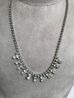 Beautiful Vintage Delicate Diamante Rhinestone Crystal Necklace. This is a vintage piece and therefore there is only one of them. It has an 11 drop round diamante design at the front and the total length when flat is 41cm. It is in very good condition. I have other vintage diamante necklaces available. Please read my POLICIES SECTION for shipping information. Www.etsy.com/shop/heathertaylorstudio/policy Please visit my home page to see all the other designs and vintage jewellery that I have avai Classic Crystal Necklace With Rhinestones, Classic Rhinestone Diamond Necklace For Wedding, Classic Diamond Necklace With Rhinestones For Wedding, Classic Wedding Diamond Necklace With Rhinestones, Classic Rhinestone Necklace With Diamond Accents, Classic Crystal Rhinestone Necklace With Diamond Accents, Vintage Jeweled Necklaces For Wedding, Vintage Diamond Necklaces With Jewels, Vintage Diamond Necklace With Jewels