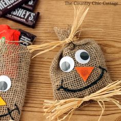 two scarecrows made out of burlocks and some candy bar wrappers