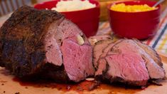 the meat is sliced up and ready to be served on the table with other dishes