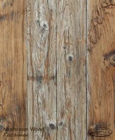 an old wooden wall with peeling paint and wood grains on the boards, as well as nails