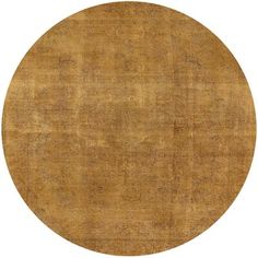 a round area rug with an oval design on the top and bottom, in light brown tones