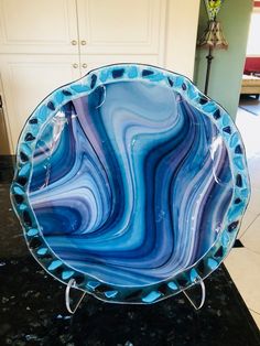 a blue and white plate sitting on top of a counter