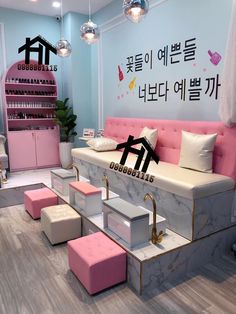 the interior of a beauty salon with pink and white furniture