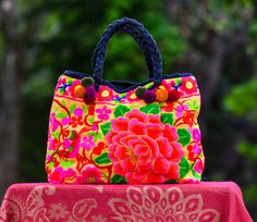 Hmong Handbag, Womens Purse, Embroidered Bag, Hill Tribe Bag, Colorful Boho Purse, Tapestry Purse, Evening Bag, Flower bag, Red Bag This beautiful bright Hmong multi colored purse / handbag is made from embroidered Hmong fabric in stunning colors. The Hmong are a hill tribe people who live in the north of Thailand - also known as the Lanna region. The bag has a zipper closure at the top and is tapered from the top to the bottom -   which adds a nice shape to the bag. Inside the bag is lined with Boho Purse, Bag Flower, Red Bag, Boho Purses, Flower Bag, Yellow And Pink, Embroidered Bag, Pink Boho, Colorful Boho