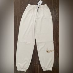 Brand New With Tags Nike Sweatpants, Size S, Off White Color Nike Casual White Pants, Nike Beige Cotton Bottoms, Nike White Sweatpants For Spring, Beige Nike Cotton Bottoms, Nike Casual Beige Bottoms, Casual Sports Bottoms In Cream Color, Casual Cream Sports Bottoms, Nike White Joggers For Spring, Nike White Sweatpants With Pockets