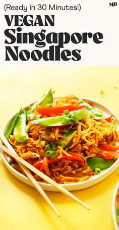 a plate of food with chopsticks in it and the words vegan singapore noodles