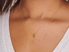 A dainty stone and delicate metallic chain are combined to create this Gold Pendant Necklace in bright peridot, your new favorite wear-anywhere accessory. The birthstone for the month of August is Peridot. This bright green gemstone brings energy to the wearer and symbolizes creativity. Authentic natural peridot stone; Made of 14K gold-filled. Pendant size: 6mm x 4mm with 18" chain. Hypoallergenic, nickel, and lead-free; Tarnish resistant. Ideas to choose your Birthstone Necklace: Your birth mon Fine Jewelry Lime Green Birthstone, Green Round Pendant Jewelry For Everyday, Everyday Green Round Pendant Jewelry, Delicate Green Necklace With May Birthstone, Delicate Green May Birthstone Necklace, Everyday Fine Jewelry Green Necklaces, Everyday Green Round Pendant Charm Necklaces, Everyday Fine Jewelry Green Necklace, Everyday Green Round Pendant Charm Necklace