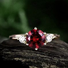 "This is a 1.25 carat garnet engagement ring in solid gold,about 7mm round cut. The accent stones are moissanites,forever classic quality. It can be made in any ring size. However please contact me to custom make it to a special big or small size. It can be made in white gold,rose gold or yellow gold with 14k or 18k. However for some people who are nickel allergic,I can also make it to 925 sterling silver to make you can wear it. The ring is handmade,very high quality! 30 days money back guarant Elegant Round Ruby Promise Ring, Classic Promise Jewelry With Lab-created Ruby, Classic Lab-created Ruby Jewelry For Promise, Fine Jewelry With Round Cut Lab-created Ruby For Wedding, Fine Jewelry With Lab-created Ruby In Round Cut, Elegant Jewelry With Lab-created Ruby For Promise, Elegant Lab-created Ruby Jewelry For Promise, Vvs Clarity Round Cut Lab-created Ruby Jewelry, Timeless Ruby Jewelry With Vvs Clarity