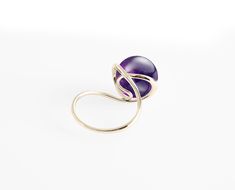 "[Ring] Lyra (purple version) [Metal Purity] 14 Karat solid yellow gold [Gemstone] Amethyst [Gem Type] Natural; non-treated / enhance [Dimension] H10mm x W20mm [Ring Size] Please select your size in \"Ring Size\" option. All sizes available. You can also select other karat gold color too. \"Perfection is achieved not when there is nothing more to add, but when there is nothing left to take away\". \"Lyra\", the ring of sheer elegance, it harmonize your formal outfits and great for a causal look. Modern Gold Amethyst Gemstone Ring, Elegant Gold Amethyst Promise Ring, Purple Amethyst Birthstone Ring For Formal Occasions, Elegant Amethyst Birthstone Crystal Ring, Elegant Gold Amethyst Ring With Center Stone, Elegant Yellow Gold Amethyst Open Ring, Formal Purple Amethyst Birthstone Ring, Elegant Purple Crystal Ring With Prong Setting, Modern Yellow Gold Amethyst Ring Gift