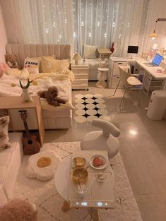 a living room filled with lots of white furniture