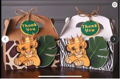 two thank you boxes with lion faces on them