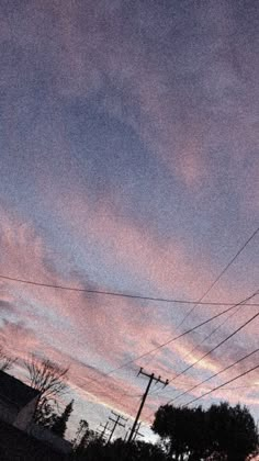 the sky is pink and blue at sunset