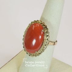 Vivid oxblood red Sardinia Coral Ring set in 14k yellow gold!Ring Size: 6.25Total Weight: 8.45 gramsPrecious Metal: 14k solid goldPrecious stones:-Coral Center Stone: 22.1mm x 15.5mm, 14.5caratsHallmark: 14k, TAIWAN Red Polished Finish Jewelry For Formal Occasions, Red Polished Jewelry For Formal Occasions, Red 14k Gold Ring Gift, Collectible Yellow Gold Jewelry With Oval Cabochon, Red Heirloom Rings For Formal Occasions, Formal Red Jewelry With Polished Finish, Classic Carnelian Jewelry For Anniversary, Red Polished Finish Formal Jewelry, Heirloom Red Rings For Formal Occasions