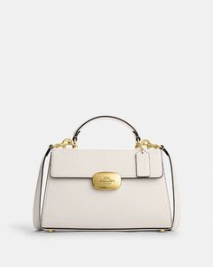 COACH® | Eliza Top Handle Elegant Flap Shoulder Bag With Handle Drop, Elegant Satchel With Handle Drop And Flap, Elegant Flap Satchel For Fall, Elegant Flap Satchel With Detachable Strap, Coach Outlet, Small Accessories, Handle Bag, You Bag, Inside Pocket