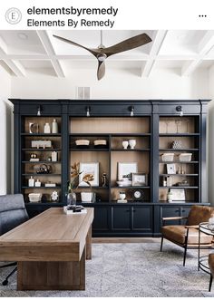 a living room filled with furniture and a ceiling fan in the middle of it's bookcase