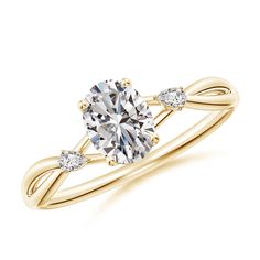 a yellow gold engagement ring with an oval cut diamond