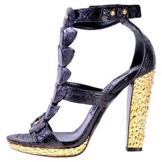 New Tom Ford Black Alligator High Heel Shoes Sandals Italian Size 41 - US 11 Black Alligator t-bar Sandals, Metallic Gold High Heel and Platform, Gold-tone Metal Studs, Adjustable Ankle Strap, Leather Sole and Insole. Heel Height - 5 inches (12.5 cm ), Platform - 6/8 inches ( 1.5 cm ). Made in Italy. New with box. Tom Ford Heels, Toms Shoes Outfits, Metallic Gold Heels, Gold High Heels, T Strap Shoes, Black Alligator, Ford Black, Gold Heels, T Strap Sandals