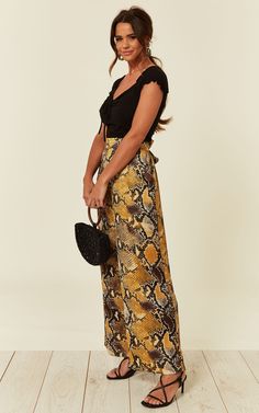 - trendy snakeskin print trousers  - wide-leg design  - elasticated waist   - tie up front or back  - silky feeling fabric  - two side pockets  - for day and night out wear. Elasticated Waist Trousers, Snake, Silk, Printed, Wide Leg, High Waisted Yellow Snake, Printed Trousers, Snakeskin Print, Leg Design, Straight Leg Trousers, The Search, Wide Leg Trousers, Snake Print, Waist Tie