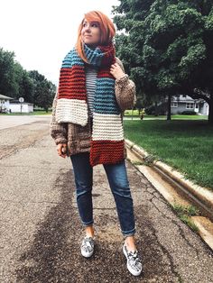 Stay warm - but keep it fashion. Our Stripe Up Your Life Scarf will help you do just that! This is a hand-knitted long, oblong style scarf with many ways to wear! With a length of 84" you can wrap it once or twice depending on your own height! Spiced Skies features colors Burnt Orange, Sky, and Winter White! Fiber Content: 100% merino wool Why Luxury? The Nickichicki Luxury Line features clothing and accessories hand-knit in 100% natural fiber yarns; typically either merino wool or Peruvian high Fall Knit Infinity Scarf One Size, Fall One Size Knit Infinity Scarf, One Size Knit Scarves, Casual Chunky Knit Scarf, Fall Chunky Knit Infinity Scarf, Knit Scarves For Fall Cold Weather, Fall Knit Infinity Scarf, Casual Chunky Knit Infinity Scarf For Fall, Casual Knit Scarves