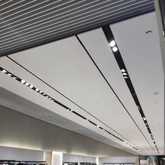 the lights are on above the bookshelves in the library