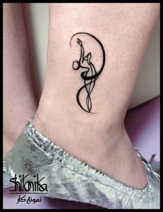 a woman's foot with a tattoo on it