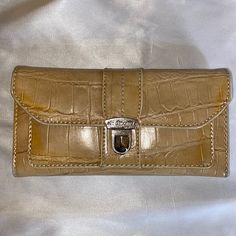 New, Never Used! 7.5” X 4”, Lots Of Storage; 13 Separate Card Pockets, Front Pocket, Zippered Change Storage Purse, Removable Checkbook And Slot For Pen. Snaps Shut With Two Size Options. Beautifully Crafted And Practical. Pet And Smoke Free Home. Elegant Tan Rectangular Wallet, Trendy Beige Leather Wallet, Trendy Rectangular Formal Wallets, Classic Tan Bag With Card Slots, Beige Leather Clutch With Card Slots, Elegant Wallet With Cell Phone Pocket, Everyday Tan Rectangular Wallet, Rectangular Faux Leather Wallets For Daily Use, Brown Clutch Wallet With Snap Closure