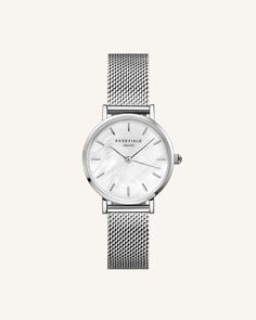 Rosefield The Small Edit White Silver Watch 26WS-266 Rosefield's The Small Edit White Silver Watch 26WS-266 is an homage to the timeless elegance of New York, embodied in a sophisticated wristwatch. The 26mm case size endows the watch with a refined and compact presence that speaks to its vintage inspiration. Detailed Design Every detail of the Small Edit has been carefully considered. The watch comes equipped with a choice of either a mesh or leather strap, adding a further layer of customizati Everyday Jewellery, Cute Watches, Watches Women, Watch For Women, Mesh Bracelet, Stainless Steel Mesh, Seiko Watches, Steel Mesh, Beauty Items