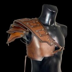 a mannequin with leather armor on it's back