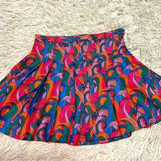 Never Worn Small Black Mark On Skirt, Shown In Pic, Barely Noticeable Pink Printed Skirt For Summer, Chic Multicolor Floral Print Mini Skirt, Trendy Multicolor Mini Skirt, Trendy Pleated Beach Skirt, Summer Patterned Mini Skirt, Retro Mini Skort For Day Out, Retro Pink Summer Skort, Chic Multicolor Printed Skirt, Casual Stretch Multicolor Skort