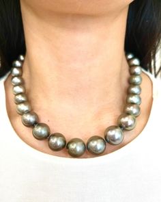 This beautiful and elegant natural Tahitian black pearl necklace features 99 diamonds weighing 2.83 ct set in 18k white gold. The pearls are between 12 mm and 15.80 mm thick. A stunning piece to add to any wardrobe. Tahitian Black Pearl Necklace, Black Pearl Necklace, Tahitian Black Pearls, Choker Necklaces, Black Pearl, Chicago Il, Favorite Jewelry, Necklace Etsy, Choker