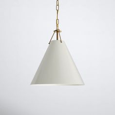 a white light hanging from a gold chain