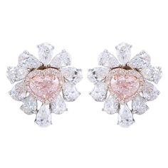 From the Museum Vault at Emilio Jewelry located on New York's iconic Fifth avenue, The focal point of these magnificent earrings feature 2 heart shape natural Fancy light Pink diamonds totaling 3.00 carats. Please inquire for details. An additional 7.27 carats of colorless diamonds creating this striking earrings into an everyday earring , which can also be worn as just plain pink diamond studs since the earring is also a jacket. Please inquire for additional details. All pieces are hand made in Emilio Jewelry, Jewelry Atelier, Pink Diamond Earrings, Yellow Diamond Earring, Pink Stud Earrings, Fancy Light, Vintage Stud Earrings, Pink Diamonds, Pink Studs