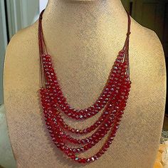 Brand New And Never Worn Stunning Ruby Red Faceted 6 Layer Necklace! This Beauty Sparkles Like Crazy. Definitely An Attention Getter. Necklace Is Adjustable. Red Crystal Round Beads Necklace For Party, Red Round Beads Crystal Necklace For Party, Red Crystal Necklaces With Faceted Beads For Jewelry Making, Red Faceted Beads Necklace For Party, Red Faceted Crystal Necklaces For Jewelry Making, Unique Red Oval Beads Necklace, Red Ruby Beaded Necklace With Faceted Details, Red Multi-strand Beaded Necklaces With Gemstones, Unique Red Multi-strand Beaded Necklace