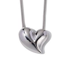 Our Embrace Heart Pendant Necklace is a symbol of enduring love, plated in sumptuous 18k gold for an everlasting shine. Its waterproof stainless steel composition ensures it is as resilient as it is beautiful. Designed to stand out, the heart pendant is a graceful twist on a classic shape, making it the perfect centerpiece for any outfit. And for those who adore a complete look, this necklace pairs seamlessly with our matching Embrace Heart Earrings, each reflecting the light and love you carry within. Heart Pendant Necklace Silver, Heart Pendant Necklace Gold, Enduring Love, Heart Pendant Necklace, Heart Earrings, Heart Necklace, Jewelry Care, Heart Pendant, 18k Gold