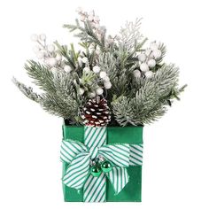 a green present with pine cones and greenery