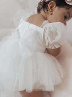 Offering a stunning design and comfortable fit, the Goddess Puff Sleeve Baby Dress features multiple layers of soft, lightweight mesh. This dress boasts a delicate lace tutu skirt and puff sleeves for a princess-inspired look. Perfect for photoshoots, special occasions, and even weddings, this dress is available in sizes 3-24 months and features a beautiful bow tie at the back. Material: Cotton, Viscose, Lace Includes: Dress only Specifications: Garment Type: DressAge Group: Newborn/Infant/Toddl White Baby Dress, Girls Tulle Dress, Princess Inspired, Flower Fairy, Cotton Viscose, Tulle Fabric, Dressy Outfits