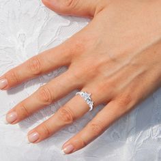 a woman's hand with a ring on it