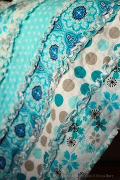 the fabric is blue and white with brown dots on it's edges, as well as polka dots