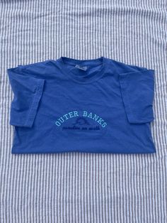 These embroidered shirts are perfect for any OBX lovers! My idea while designing these shirts was to make them as simple as possible but also fashionable! The Comfort Colors shirt makes wearing it way more comfortable than most shirts! If you would like a different thread color on your shirt(s), message me and I'm will help you find one that you will love!  1-2 weeks processing! If you have a trip planned and need your shirt ASAP, message me BEFORE you order to make sure it's possible for me to ship it out in time! It can be very hard to find Comfort Colors shirts in certain sizes and colors. So, if need be, I may have to change up the shirt colors a little bit. All of the house colors will stay the same, the shirt may just be in a different shade.  The T-Shirt will be Gildan if Comfort Co Outer Banks Tshirt, Obx Paradise On Earth, Mineral Wells, Embroidered Shirts, My Idea, Paradise On Earth, Comfort Colors Shirt, Embroidered Tshirt, Tshirt Design