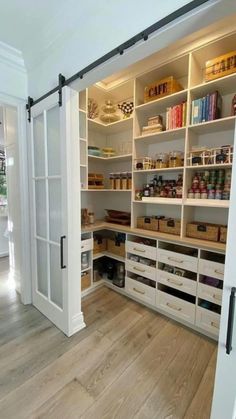 an open pantry with lots of shelves and drawers